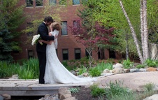 The Inn at St. John's Plymouth, MI - Bride & Groom kissing in Garden